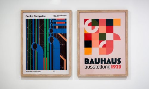 Two framed posters: one of Centre Pompidou with colorful pipes, and the other a Bauhaus-inspired design.